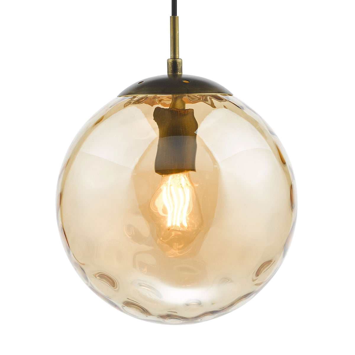 A round, amber-colored glass pendant light with a textured surface and a glowing bulb inside.