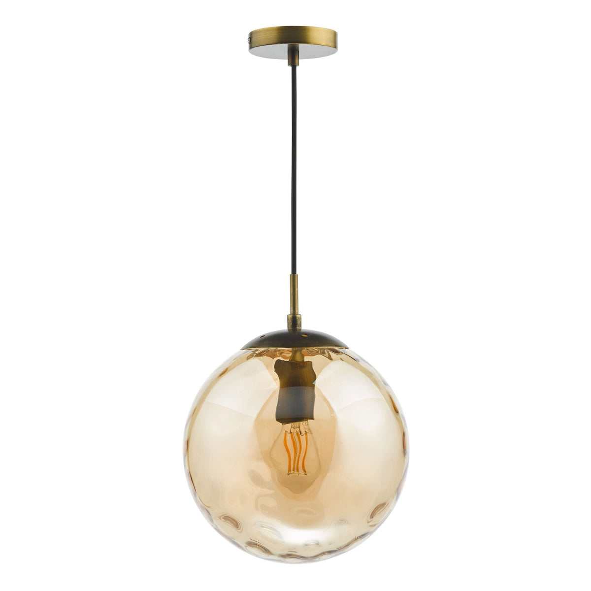 Amber glass globe pendant light with a visible filament bulb and brass accents on a white background.