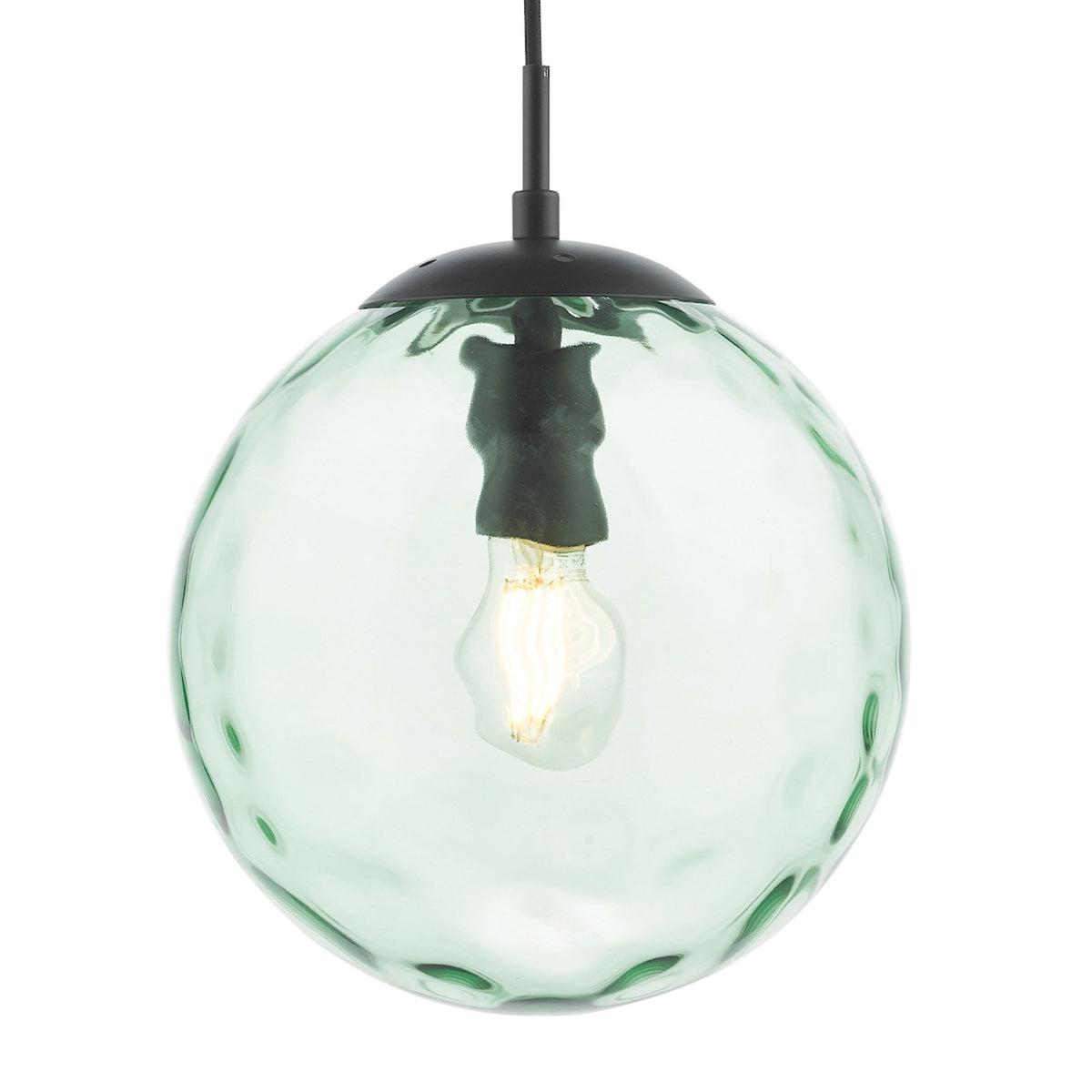 Green glass globe pendant light with a textured surface and a visible filament bulb inside, hanging from a black fixture.
