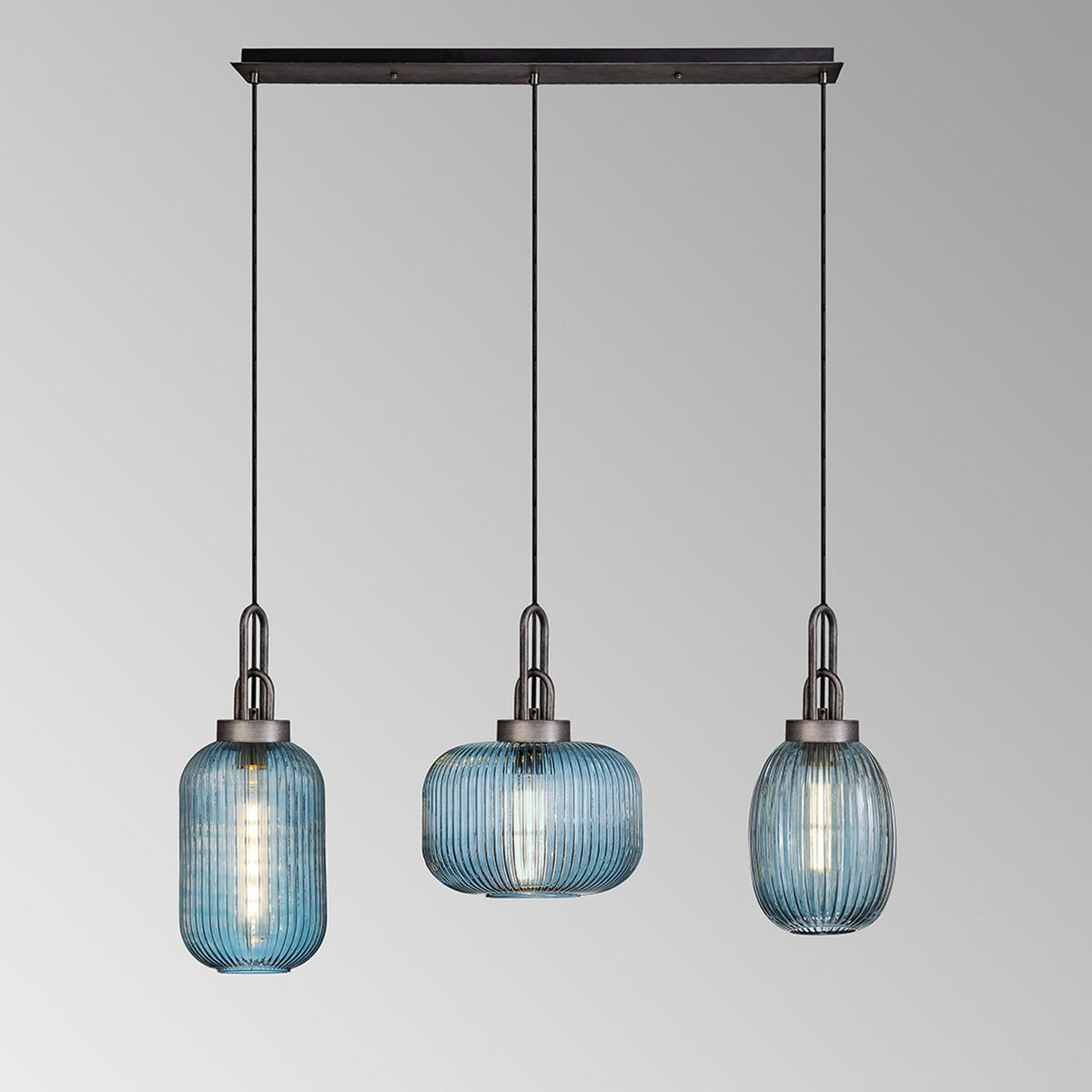 Atherington 3 Drop Linear Pendant in Aged Pewter with Ribbed Petrol Blue Shades