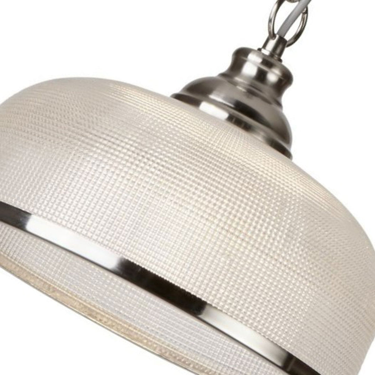 An angled close-up of the textured glass shade and polished chrome band of a pendant light.