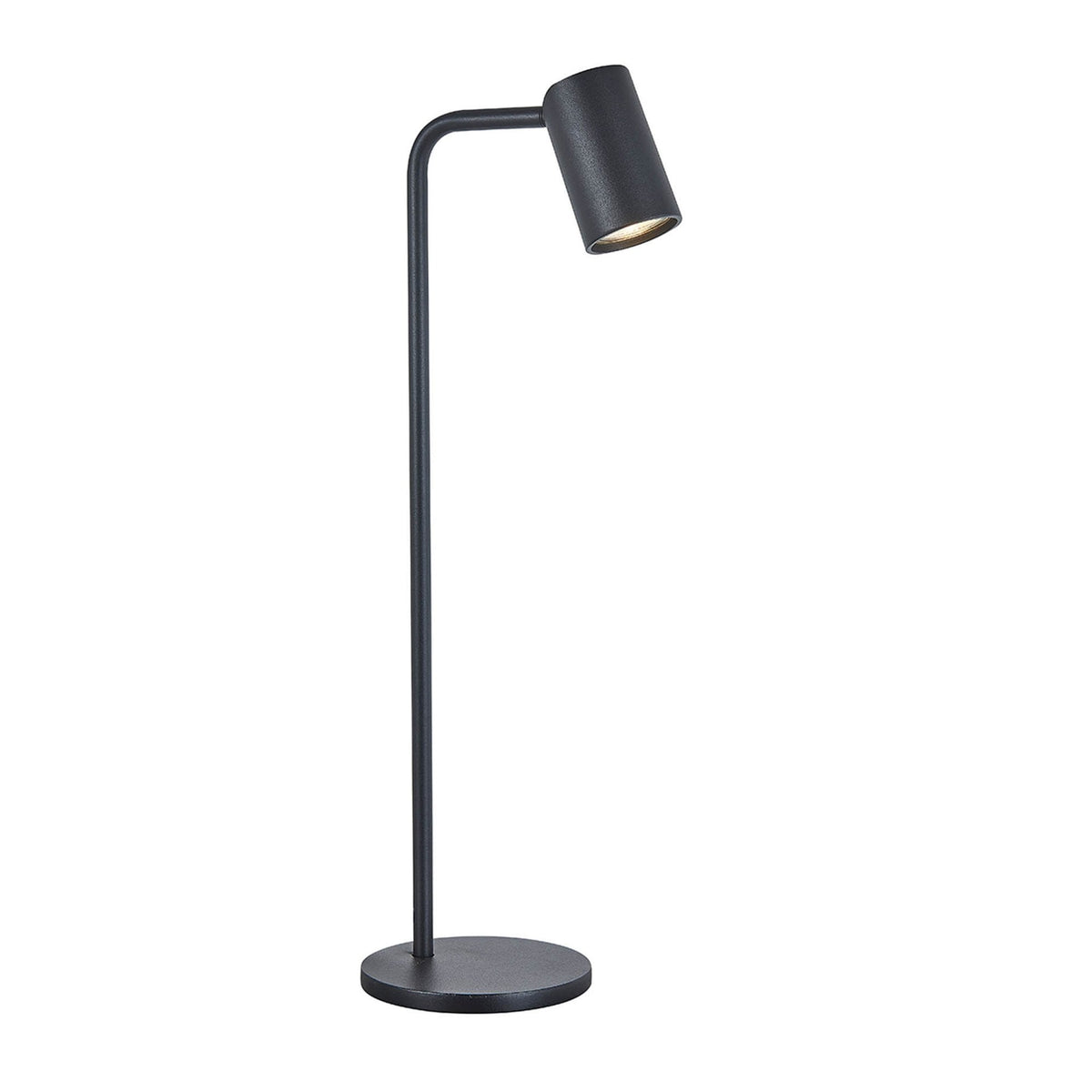 A black minimalist floor lamp with a cylindrical head shining warm light.