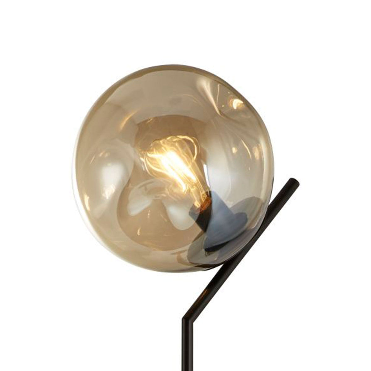 A close-up view of the smoked glass globe shade of a modern floor lamp.