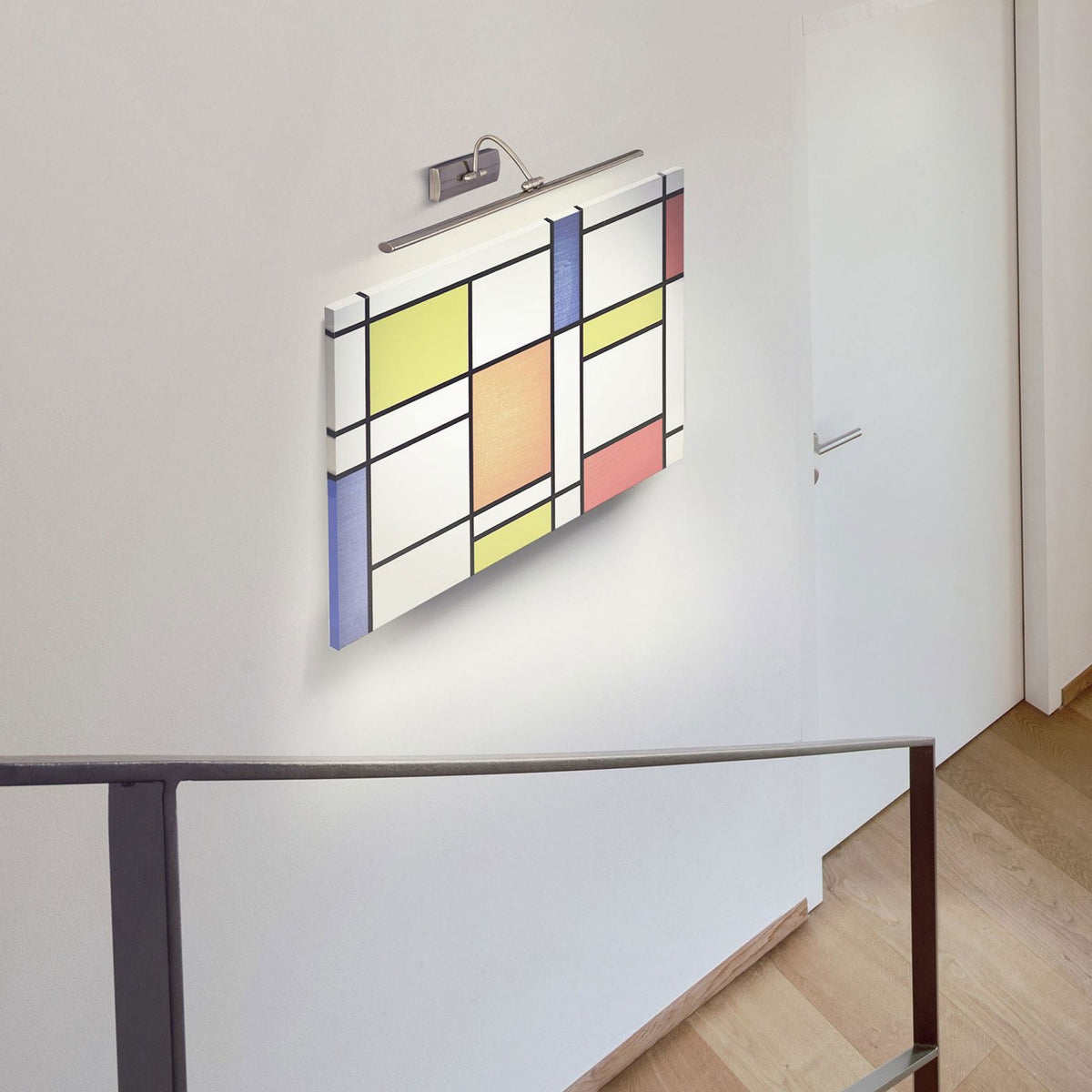 A picture light illuminating a Mondrian-style artwork in a contemporary home.