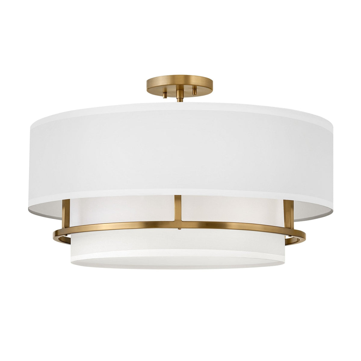 A large semi-flush ceiling light with a white fabric shade and brass accents on a white background.
