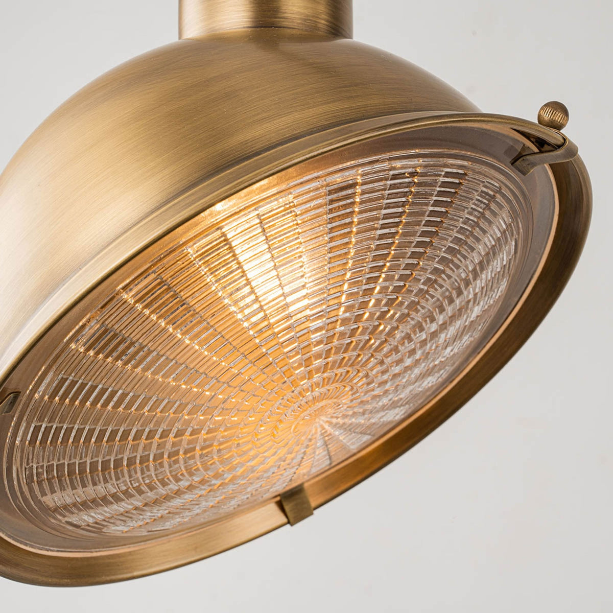 Chiswick IP44 Wall Sign Light in Antique Brass with Clear Prismatic Glass