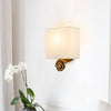 Swirl Small Wall Light in an Antiqued Gold Leaf Finish with Linen Shade