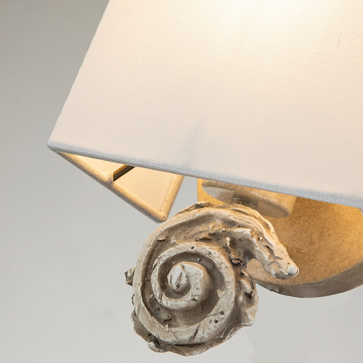 Swirl Small Wall Light in an Antiqued Bone White Finish with Linen Shade