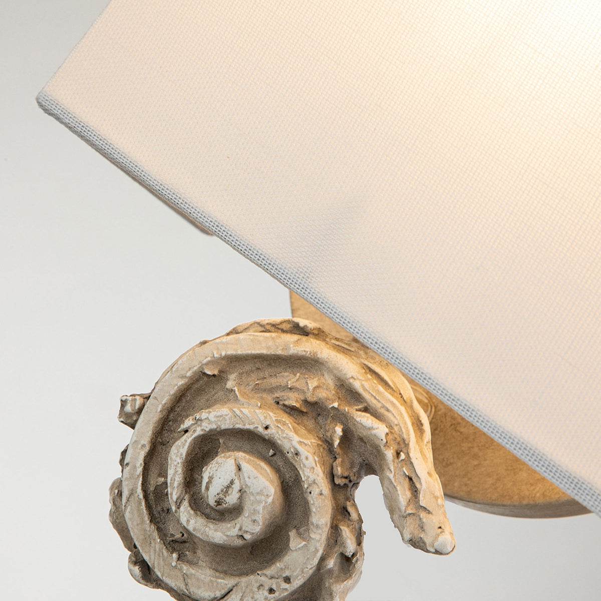 Swirl Small Wall Light in an Antiqued Bone White Finish with Linen Shade