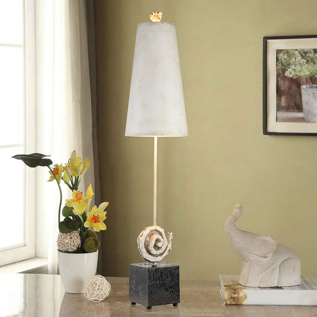 Table lamp with a dark base, a light-coloured shade, and a subtle spiral detail.