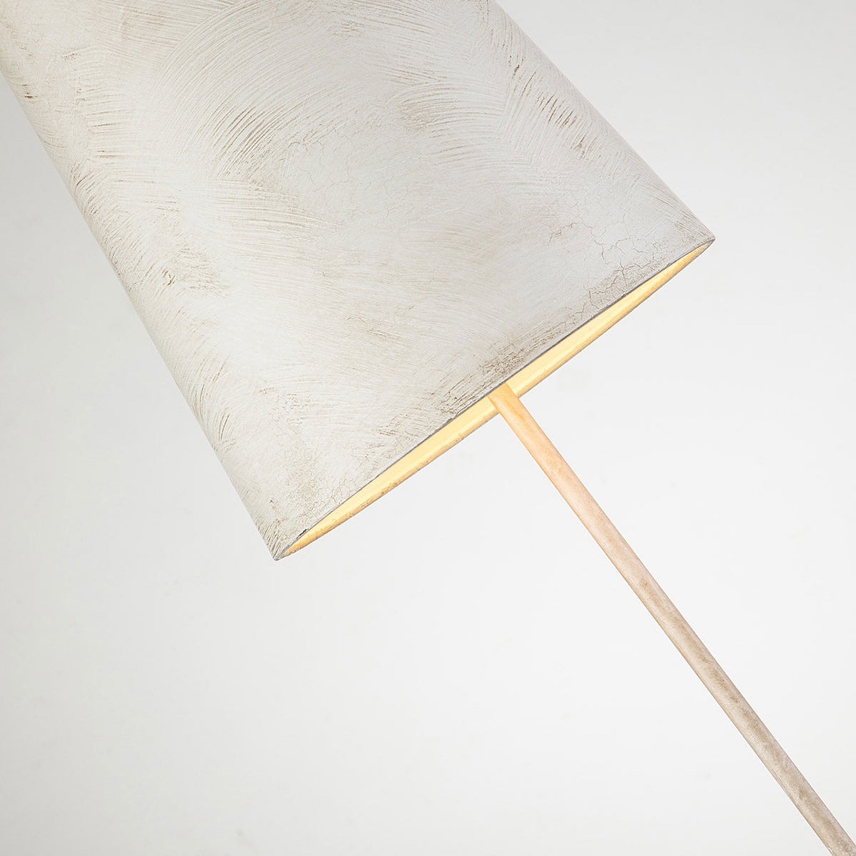 Close-up of the lamp's textured white shade, glowing with warm light from within.