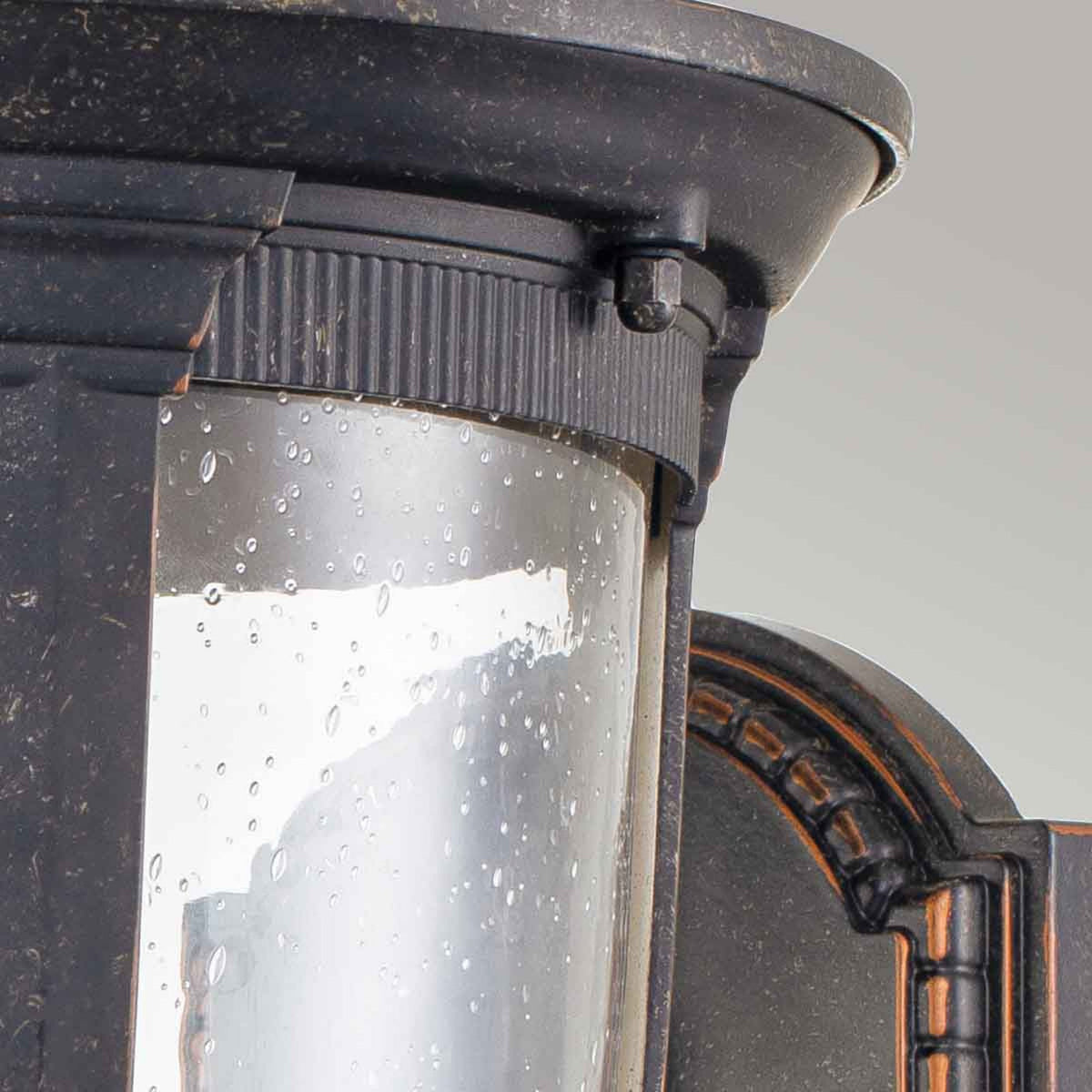 Cleveland Medium Up Arm Wall Lantern in Weathered Bronze with Clear Seeded Glass