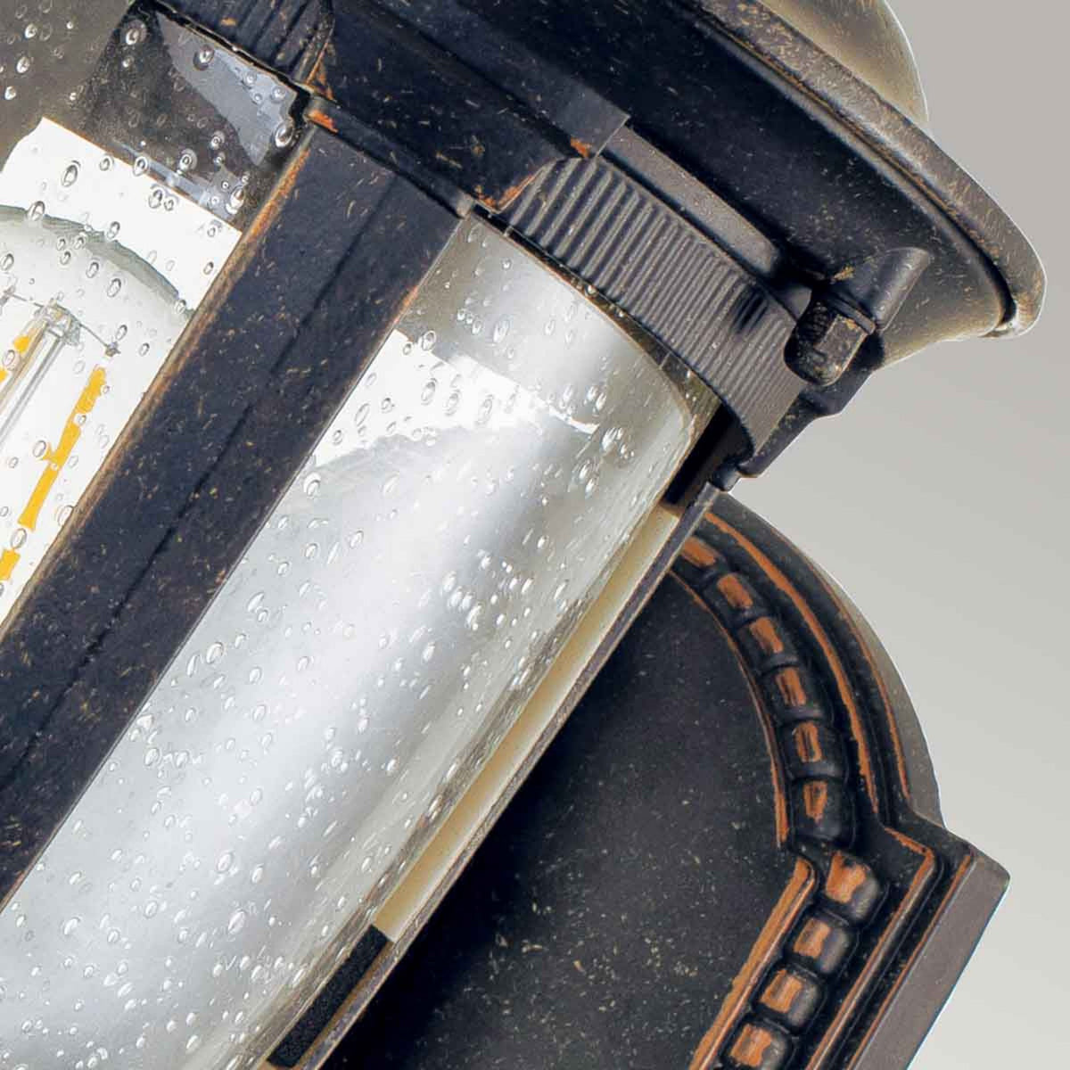 Cleveland Small Up Arm Wall Lantern in Weathered Bronze with Clear Seeded Glass