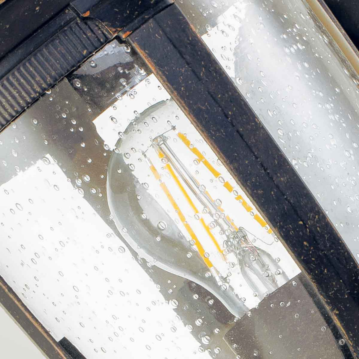 Cleveland Small Up Arm Wall Lantern in Weathered Bronze with Clear Seeded Glass