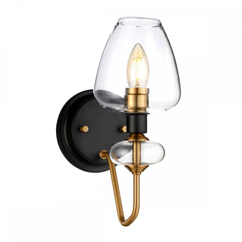 A contemporary wall light with a clear glass shade, black base, and gold accents.