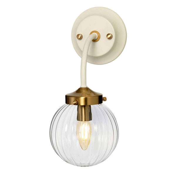Cosmos Wall Light in a Cream Finish with Aged Brass Detailing and Clear Ribbed Glass