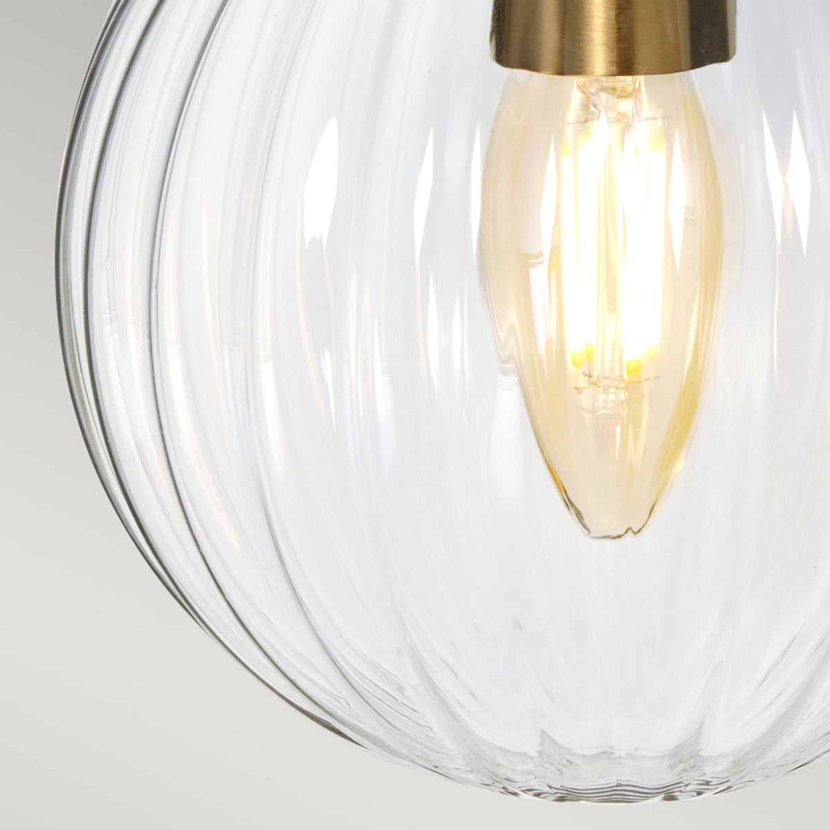 Cosmos Wall Light in a Cream Finish with Aged Brass Detailing and Clear Ribbed Glass