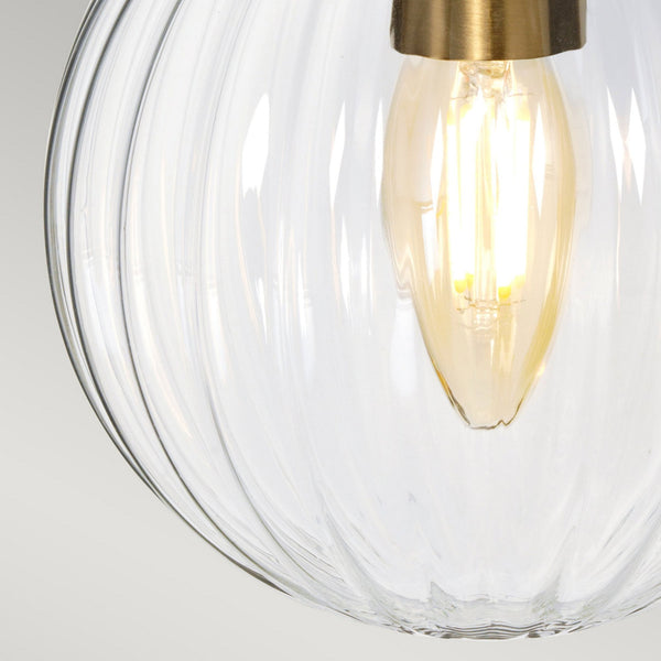 Cosmos Wall Light in a Cream Finish with Aged Brass Detailing and Clear Ribbed Glass