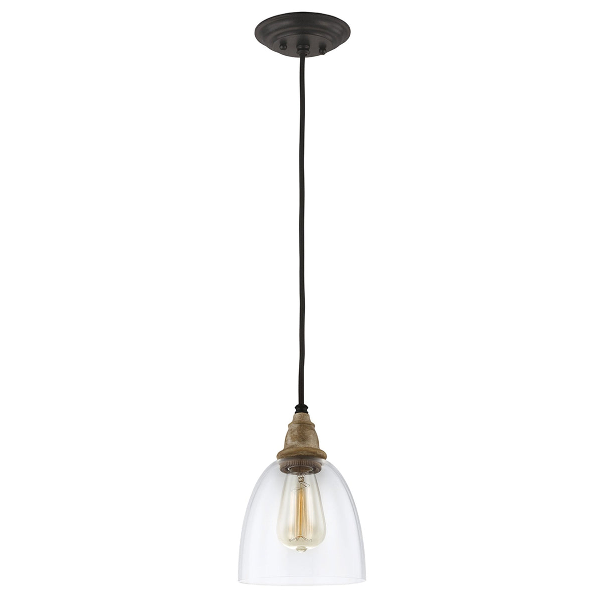 A close-up of a pendant light with a clear glass shade and exposed filament bulb.