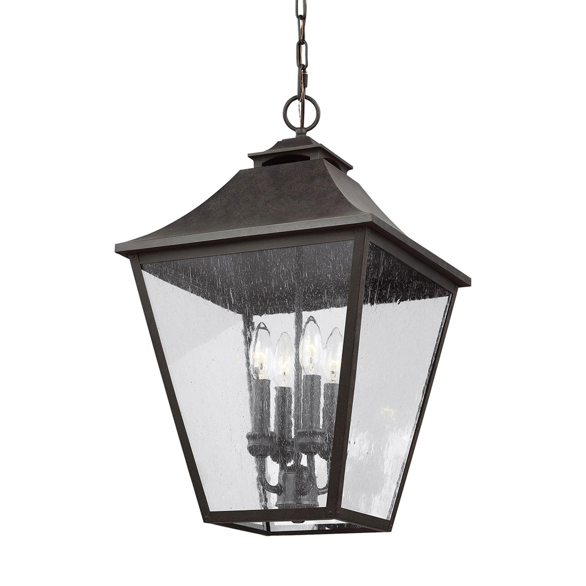 A close up view of the 3 light outdoor hanging lantern with a dark finish and clear seeded glass.