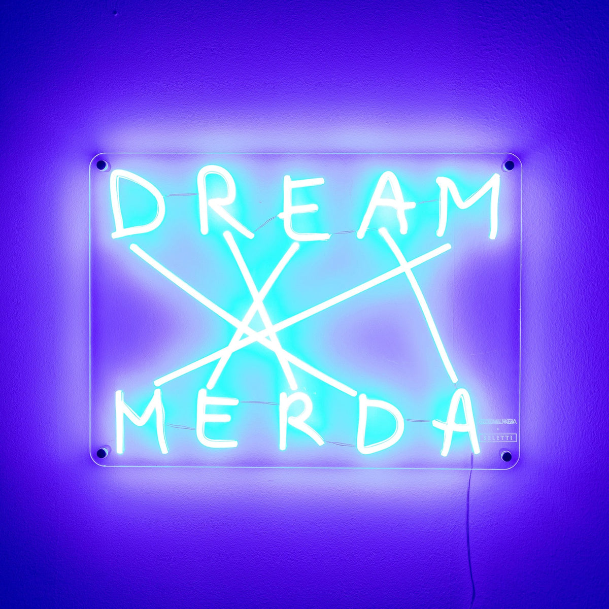 Brightly glowing neon sign reads 'DREAM MERDA' with criss-crossing lines.