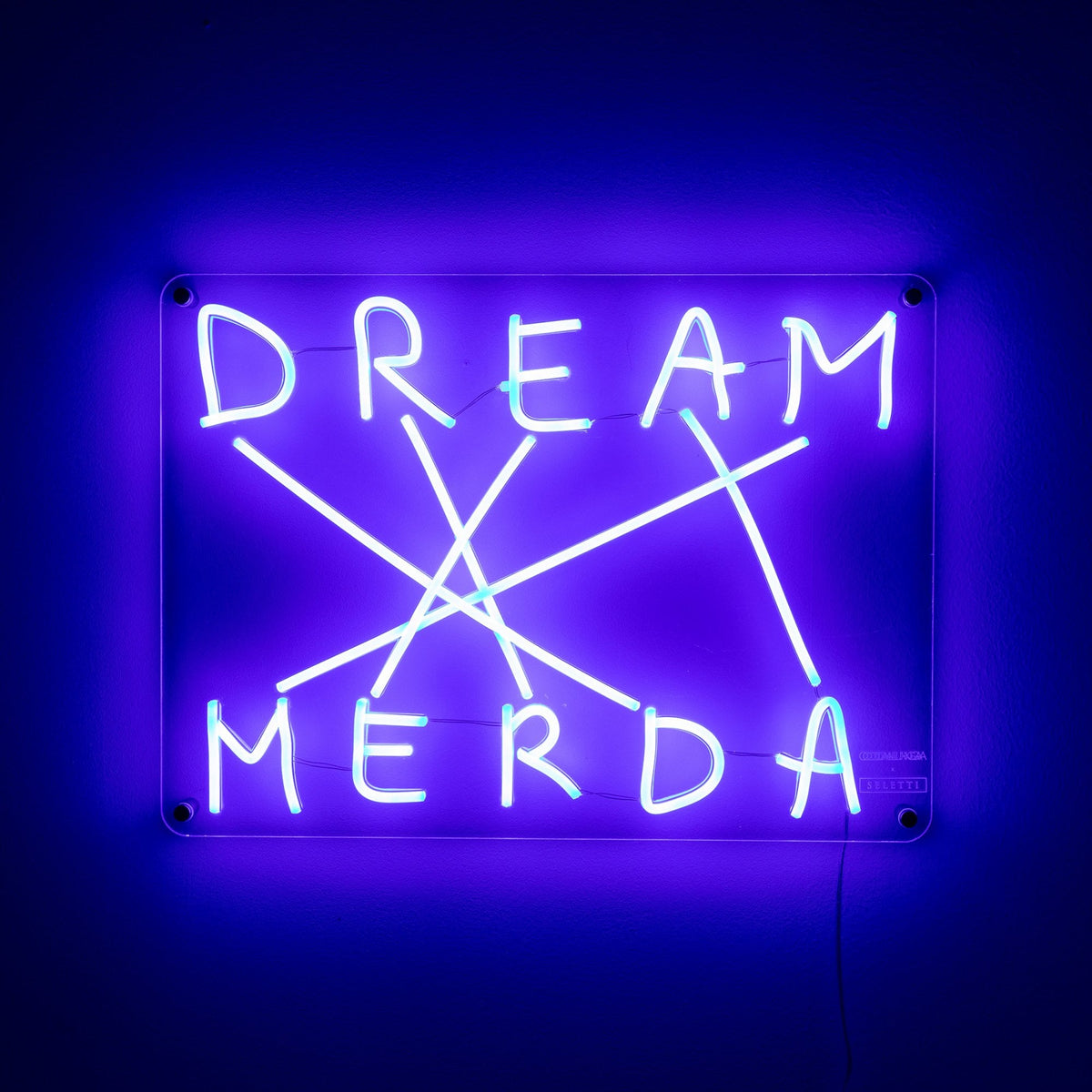 Vivid blue neon sign for 'DREAM MERDA' with lines connecting letters on a dark background.