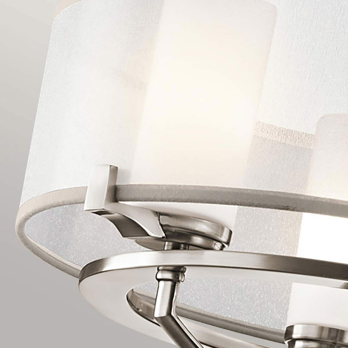 Detailed view of the internal white fabric shade and brushed nickel accents on the light.