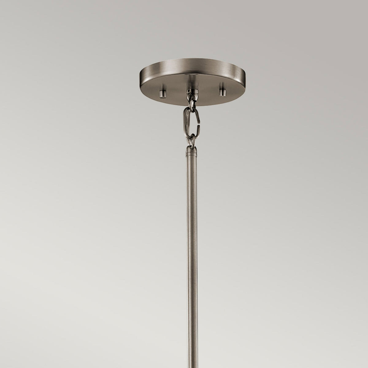 A detailed view of the pendant light's ceiling rose and part of the suspension rod.