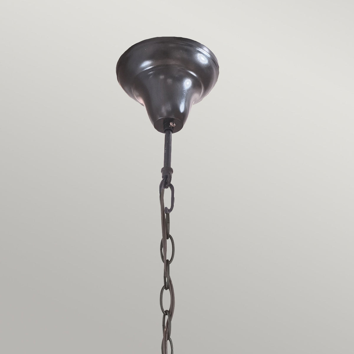 Close-up of the ceiling rose and top section of the chain for the stained-glass light.