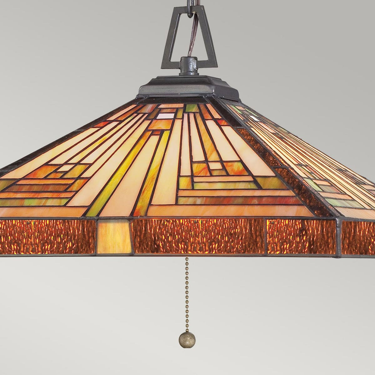 A close-up of a square Tiffany glass pendant light with a rectangular stained glass pattern.