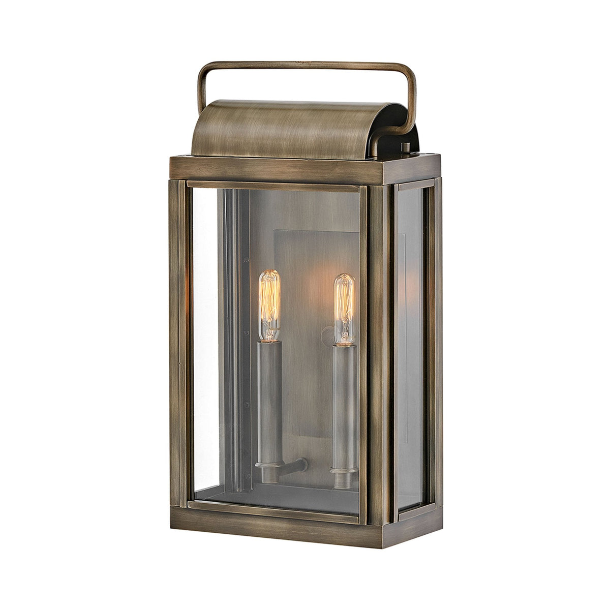 A brass outdoor lantern with glass panels and two exposed filament bulbs. 