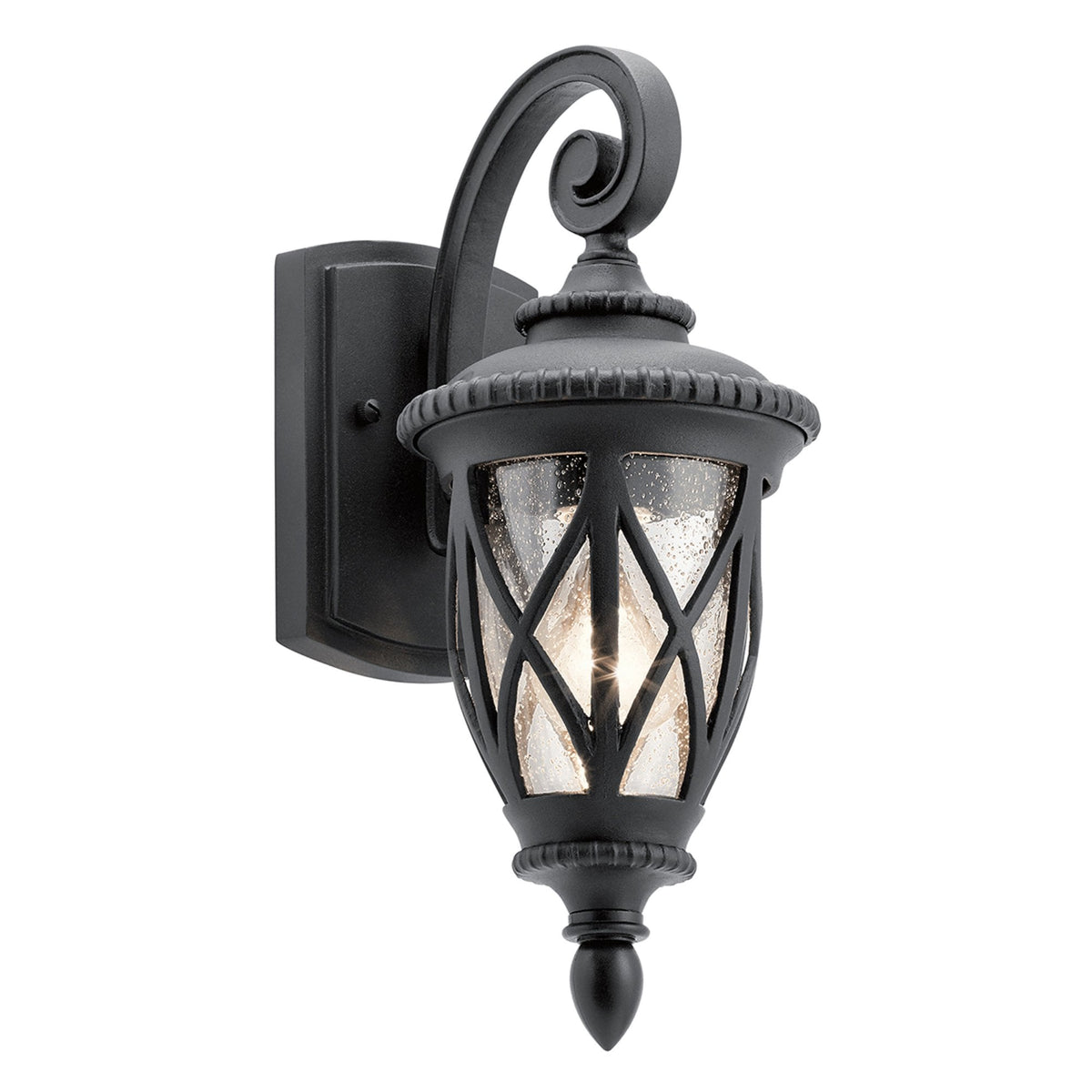 A black traditional outdoor wall light with clear seeded glass and decorative metalwork.