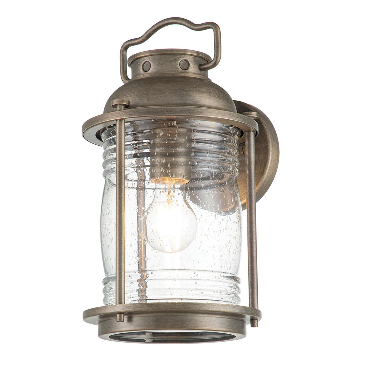 A close-up of a bronze outdoor lantern featuring a clear, seeded glass shade.
