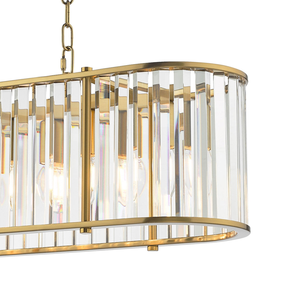 Close-up of a rectangular gold chandelier with vertical clear glass panels and exposed bulbs.
