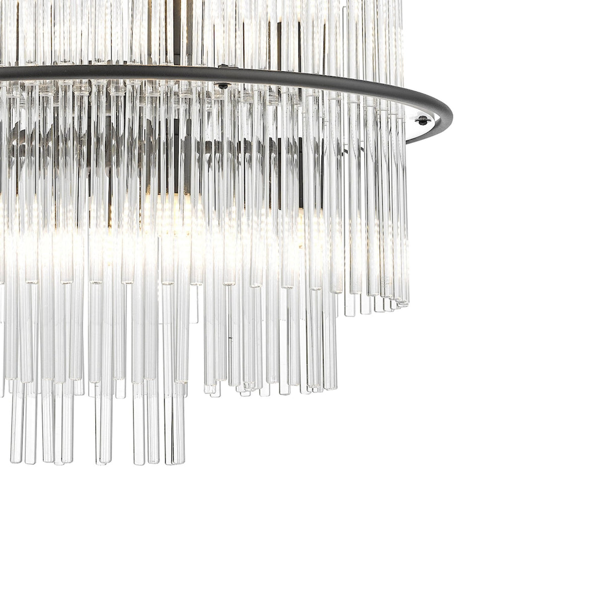 Close-up of a modern chandelier with multiple clear glass rods hanging from a dark metal ring.