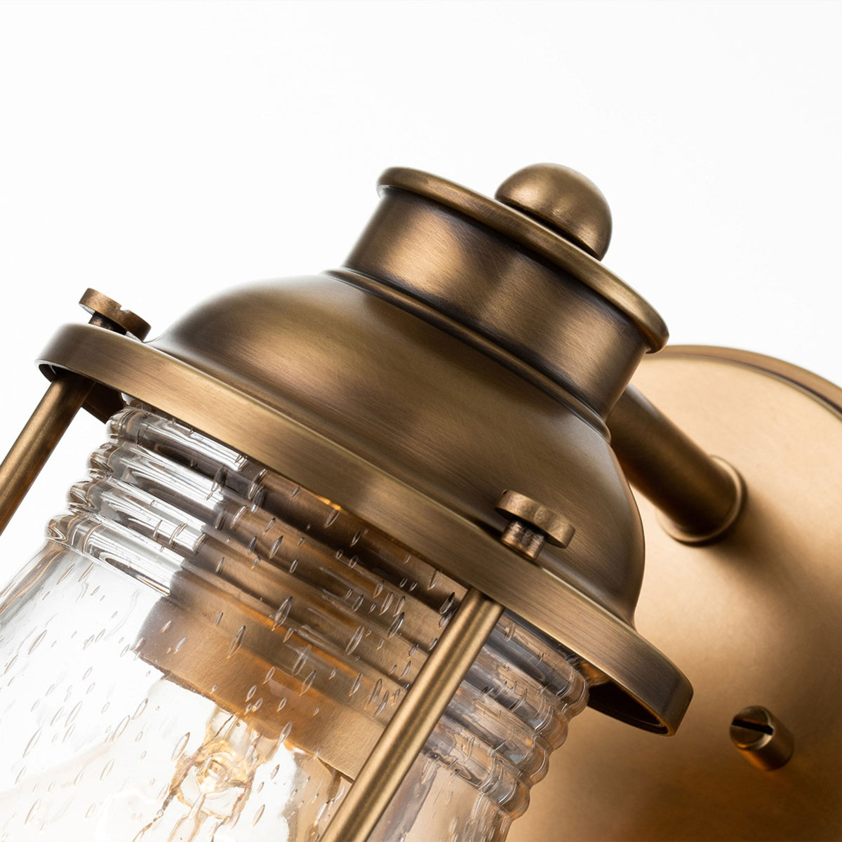 Ashland Bay Single IP44 Wall Light in Natural Brass with Clear Seedy Ribbed Glass