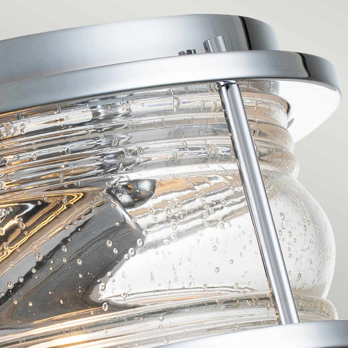 An overhead close-up of the flush mount light, highlighting the seeded glass detail.