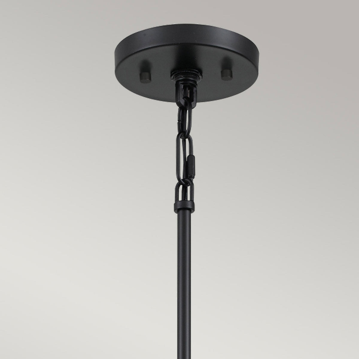 Top of the multi-light pendant showing the black ceiling rose and suspension rod.
