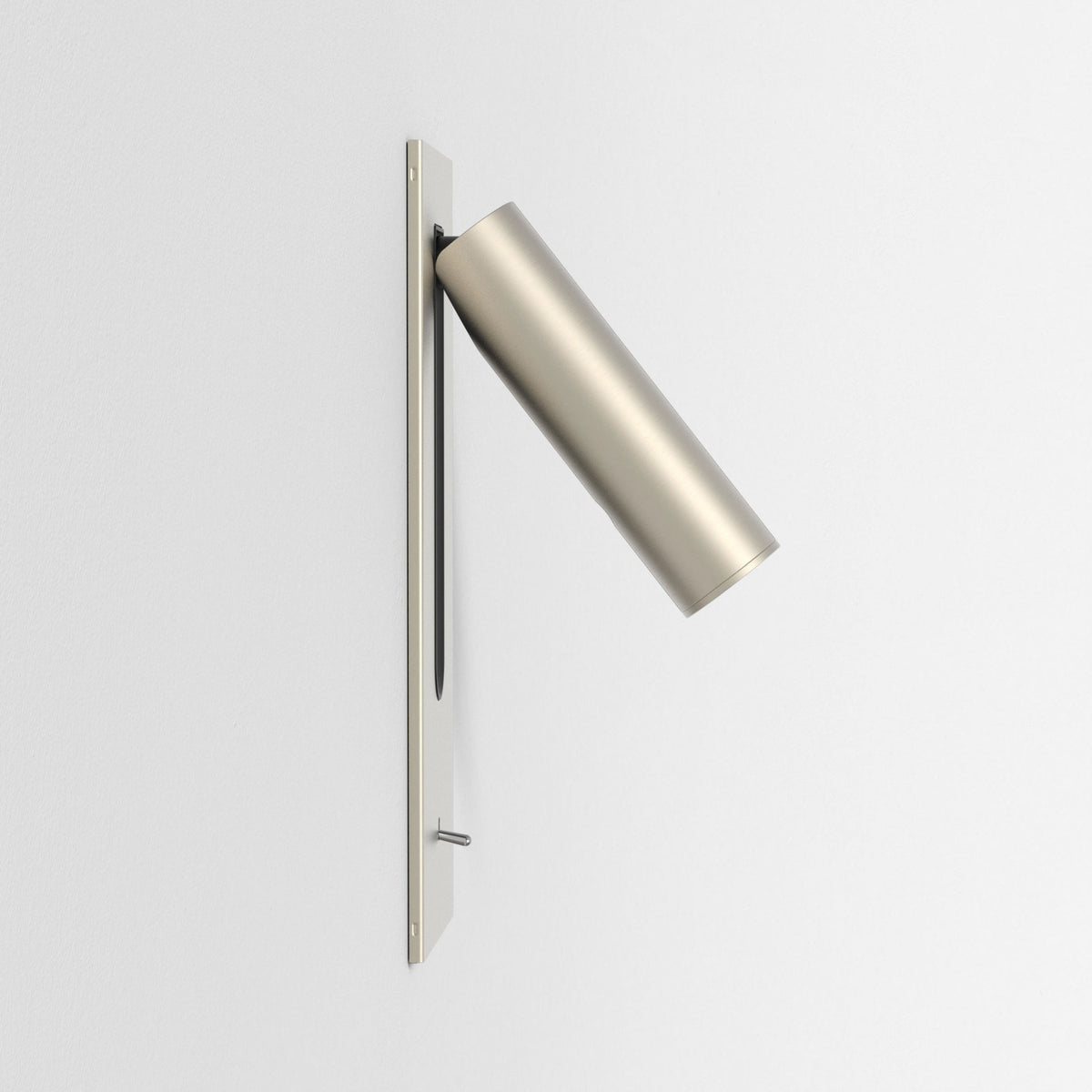Brushed metal wall-mounted reading light with a cylindrical head angled downwards