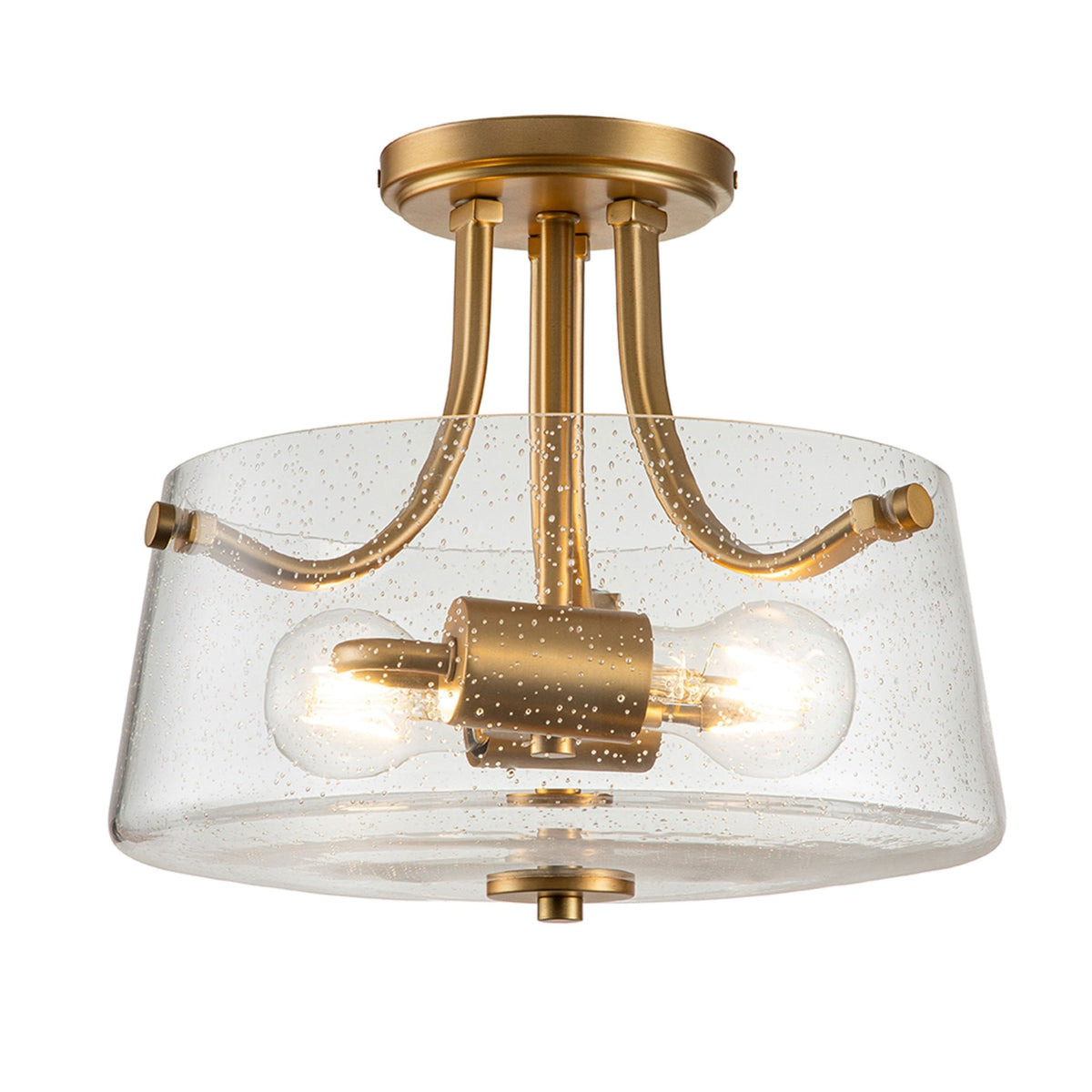 A close-up of a modern brass semi-flush mount ceiling light with a seeded glass shade.