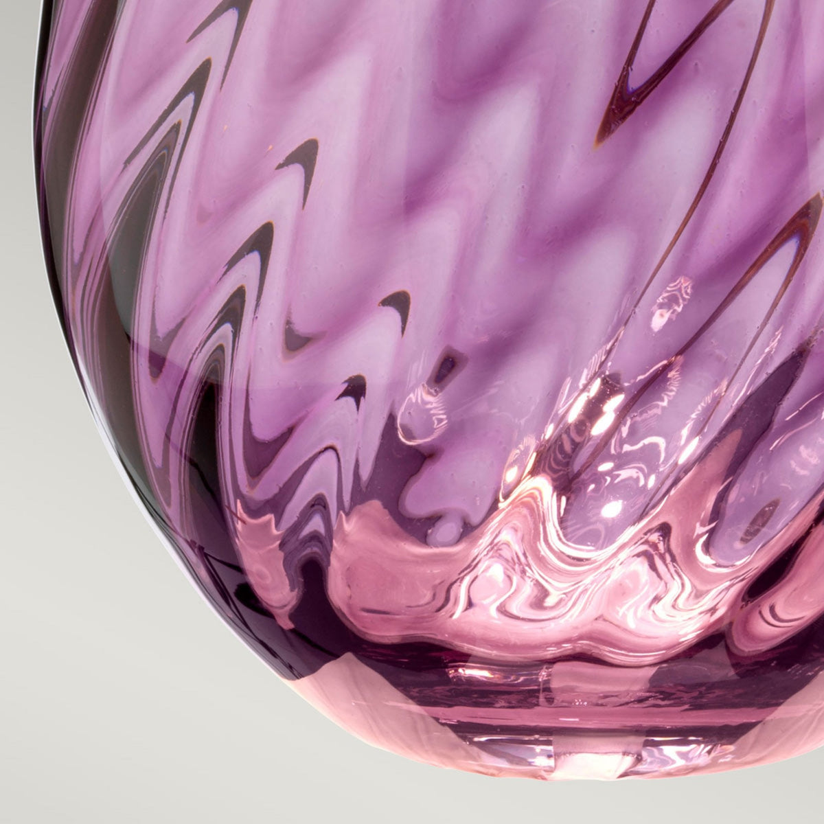 Close-up of the lamp's amethyst swirl glass base, showing the intricate pattern.