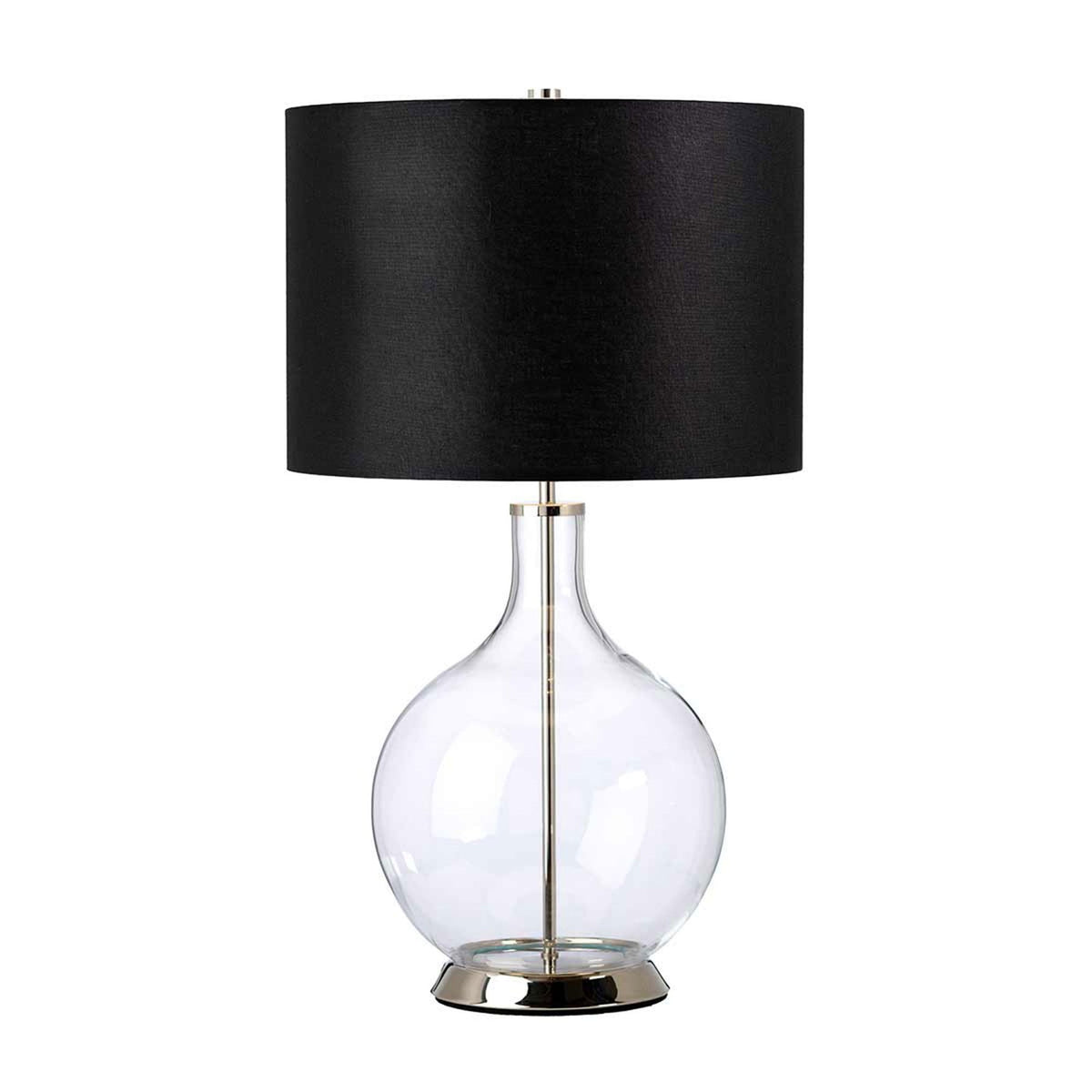 Table lamp with a large black shade, clear glass base and shiny silver stand.