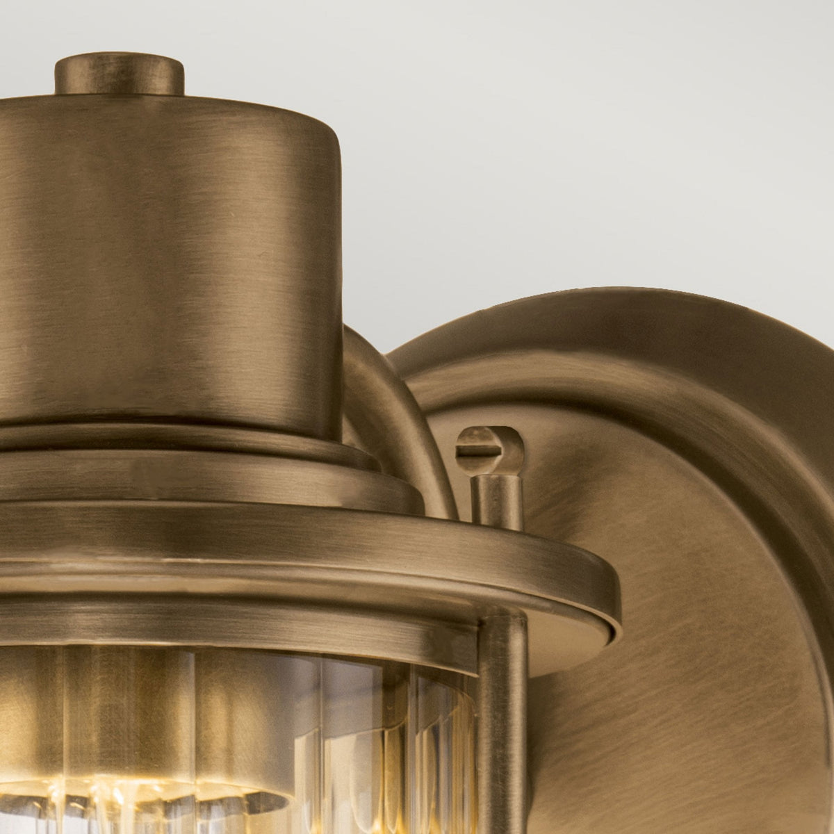 A detailed shot highlighting the robust construction of the bronze nautical wall light. 