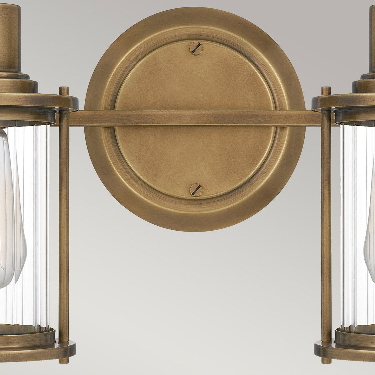 Riggs IP44 Twin Wall Light in Weathered Brass with Clear Ribbed Glass