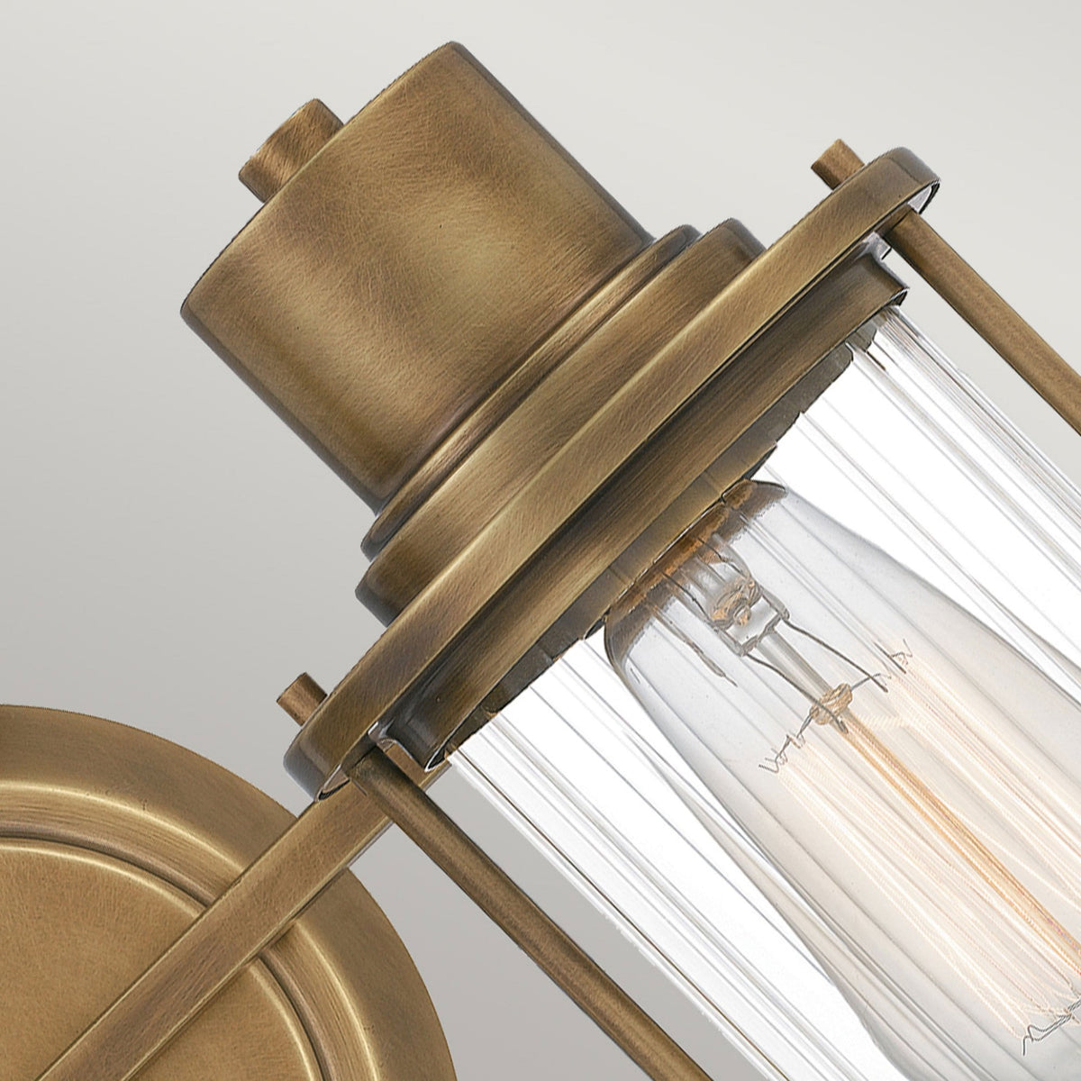 Riggs IP44 Twin Wall Light in Weathered Brass with Clear Ribbed Glass