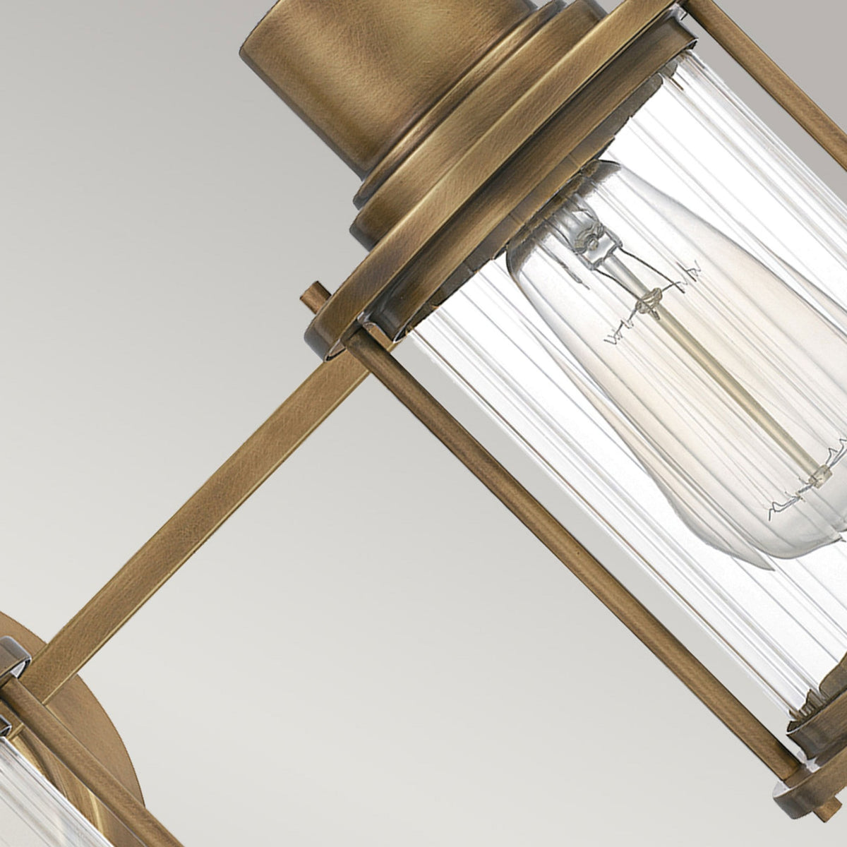Riggs IP44 Triple Wall Light in Weathered Brass with Clear Ribbed Glass
