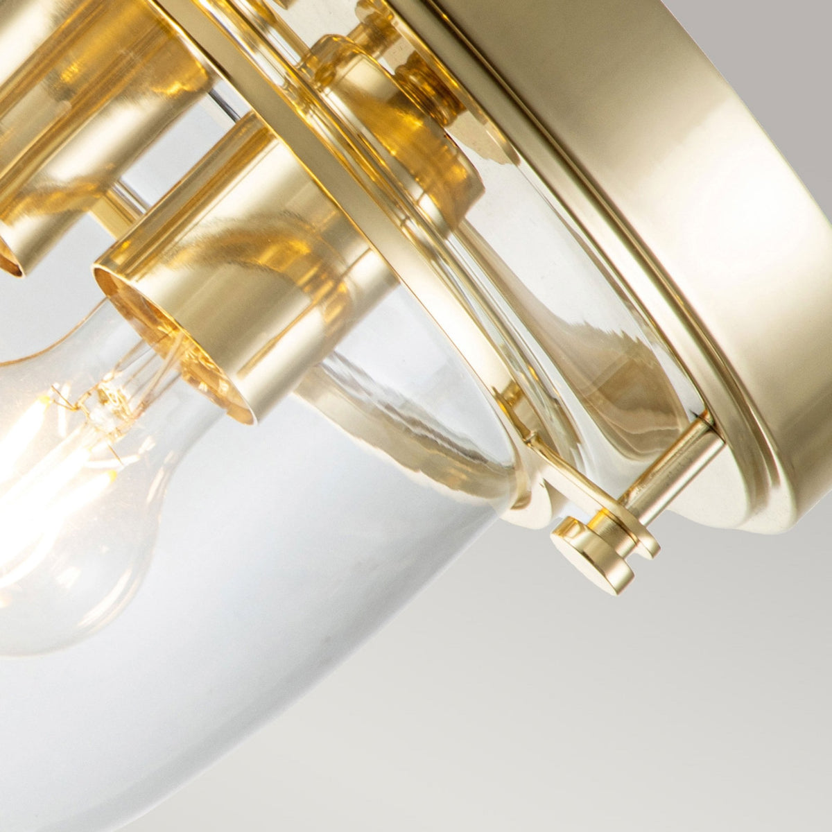 Whistling IP44 Ceiling Light in Polished Brass with Clear Glass Shade