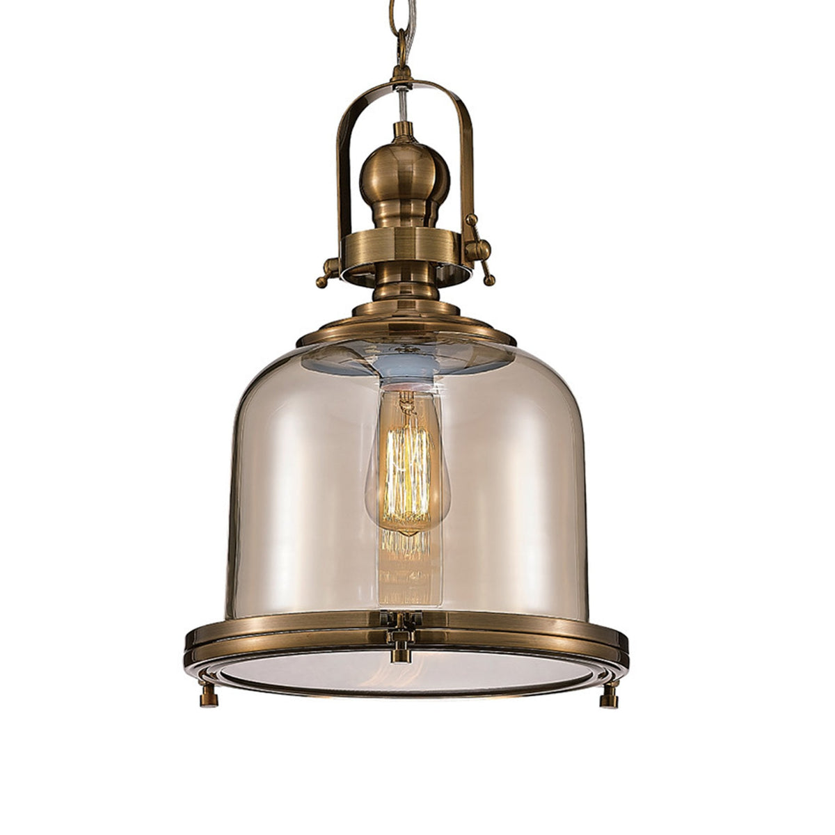 A close-up of an antique brass pendant light with a clear bell-shaped glass shade.
