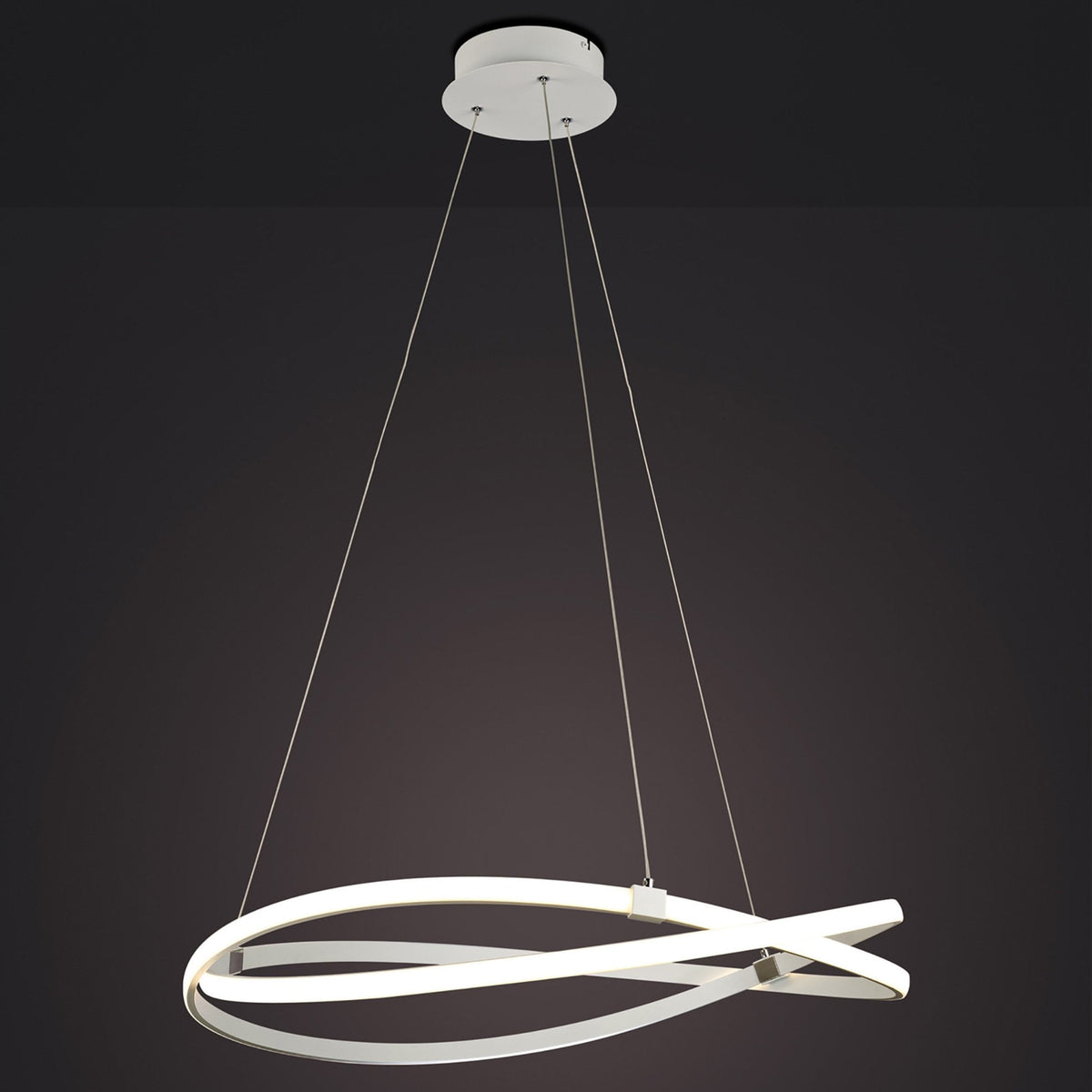 A modern white LED ceiling pendant light shaped like two intertwined rings on a dark background.