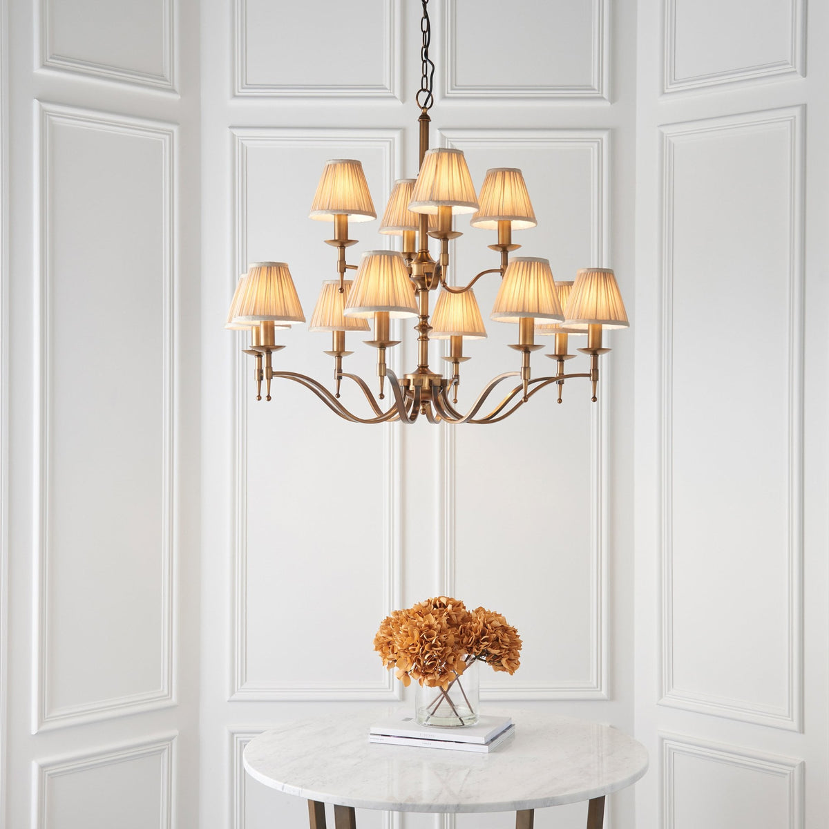 Stanford Twelve Light Pendant In Antique Brass With Beige Fabric Shades
